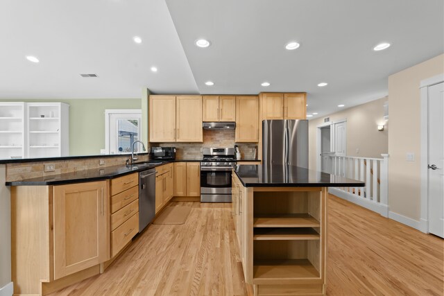 5480 Kensington Rd, Brighton, MI 48114 - kitchen featuring appliances with stainless steel finishes, light brown cabinets, a sink, light wood-style flooring, and open shelves