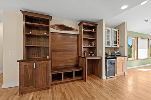 5480 Kensington Rd, Brighton, MI 48114 - indoor dry bar featuring wine cooler, light wood-type flooring, baseboards, and recessed lighting