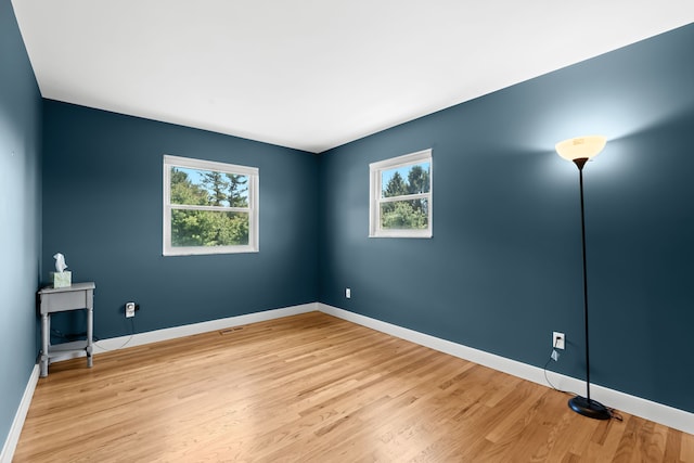 5480 Kensington Rd, Brighton, MI 48114 - spare room with light wood-style flooring and baseboards