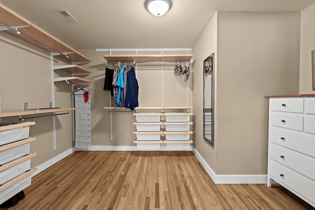 5480 Kensington Rd, Brighton, MI 48114 - spacious closet with wood finished floors