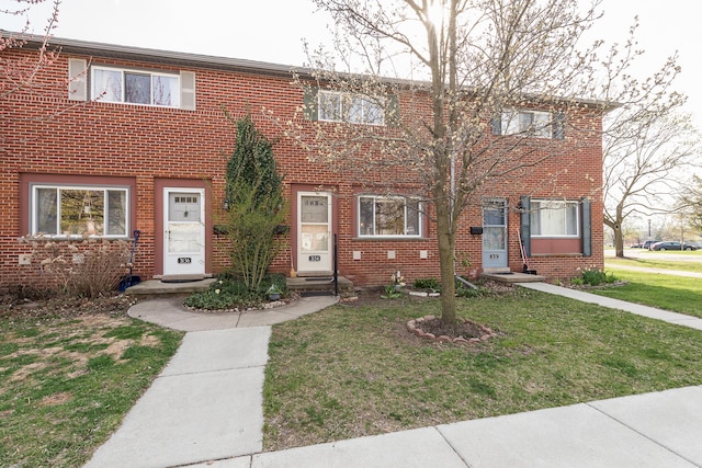 3134 Williamsburg Rd, Ann Arbor, MI 48108 - townhome / multi-family property featuring a front yard and brick siding