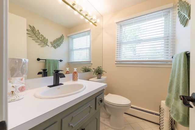 bathroom featuring vanity, tile patterned floors, a baseboard heating unit, and toilet