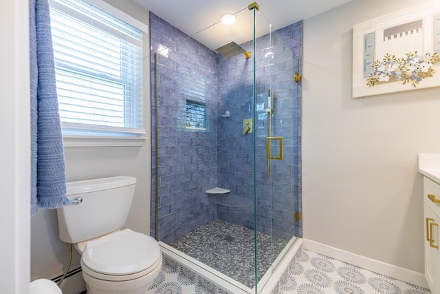 bathroom featuring vanity, toilet, baseboards, a baseboard heating unit, and a shower stall