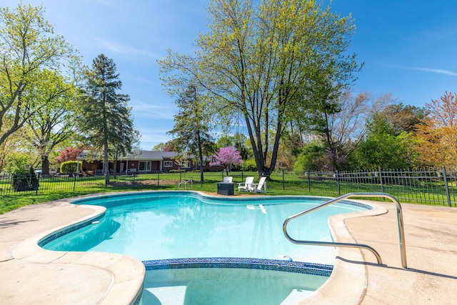 view of pool with a yard, fence, and a fenced in pool