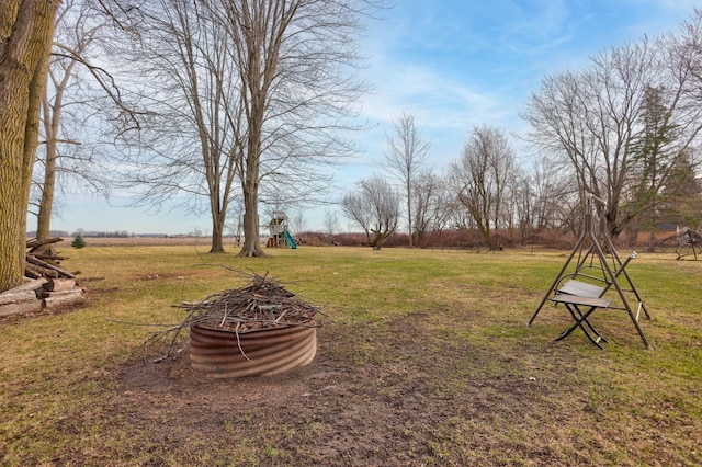 1743 Midland Rd, Bay City, MI 48706 - view of grassy yard with a playground
