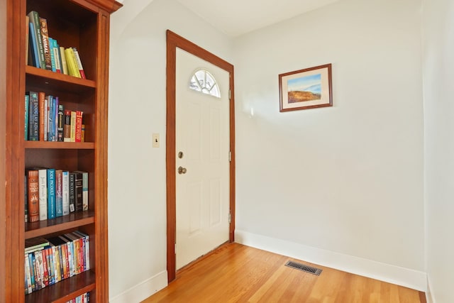 1743 Midland Rd, Bay City, MI 48706 - foyer featuring light wood-type flooring and baseboards