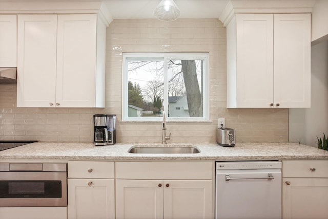 1743 Midland Rd, Bay City, MI 48706 - kitchen with a sink, white dishwasher, decorative backsplash, and white cabinets