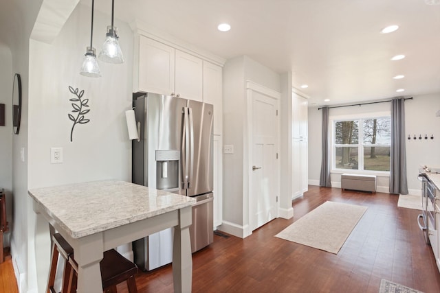 1743 Midland Rd, Bay City, MI 48706 - kitchen with stainless steel refrigerator with ice dispenser, dark wood-style flooring, white cabinets, recessed lighting, and pendant lighting