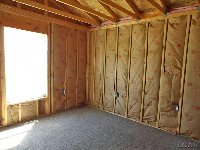 7640 S Lake Pleasant Rd, Osseo, MI 49266 - misc room with visible vents and a wealth of natural light
