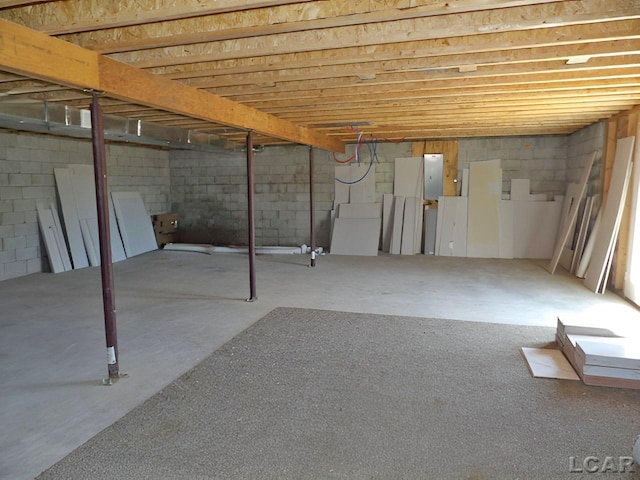 7640 S Lake Pleasant Rd, Osseo, MI 49266 - unfinished below grade area featuring concrete block wall