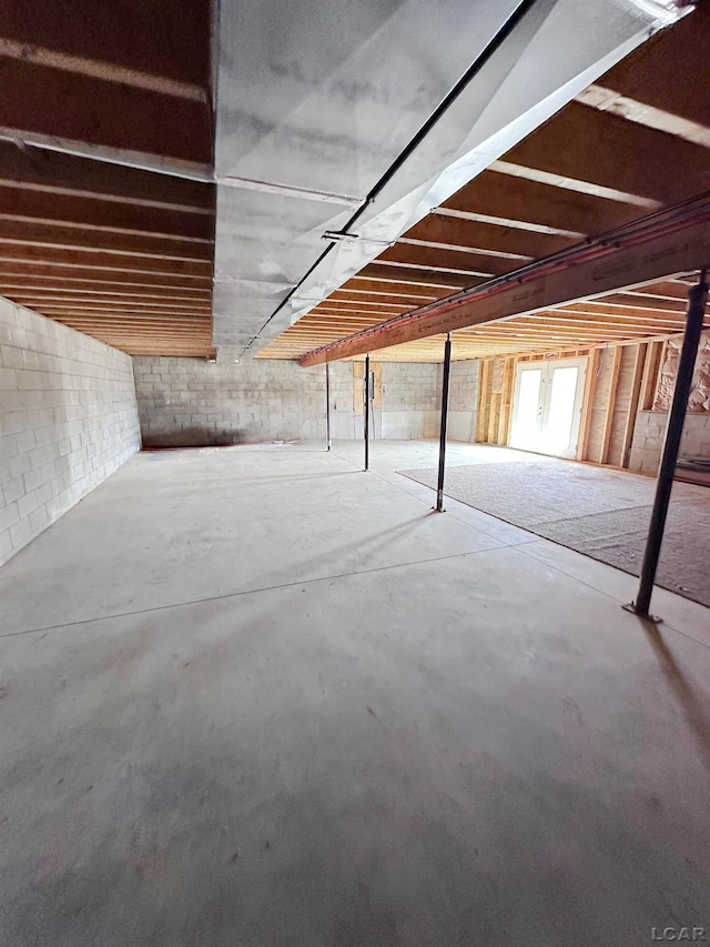7640 S Lake Pleasant Rd, Osseo, MI 49266 - unfinished below grade area with concrete block wall