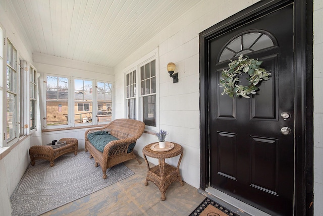 view of exterior entry featuring a porch