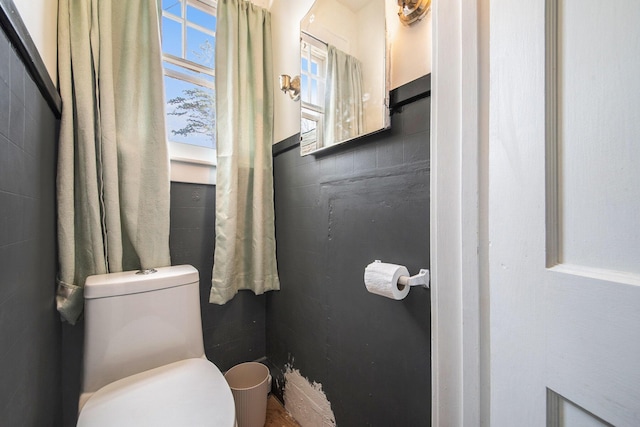half bath featuring toilet