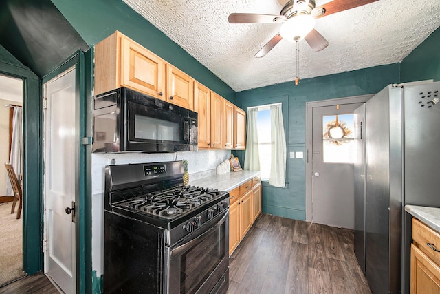 kitchen featuring light brown cabinetry, stainless steel appliances, dark wood-style flooring, and light countertops
