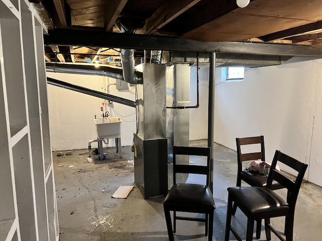below grade area with a sink
