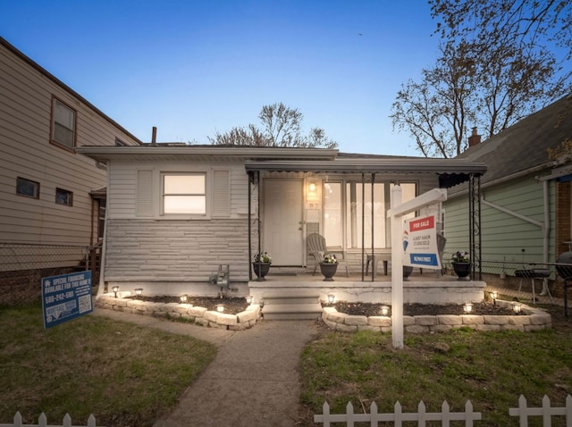 87 E Pleasant St, River Rouge, MI 48218 - view of front facade with fence and stone siding