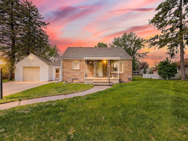 view of front of property featuring stone siding, driveway, and a shingled roof