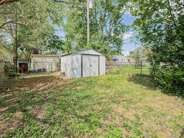 view of yard with a shed and an outbuilding