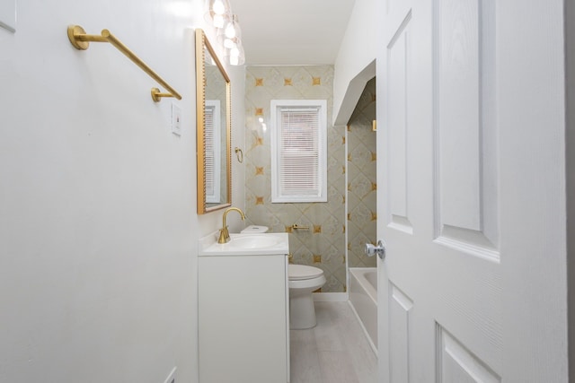 full bath with toilet, shower / washtub combination, and vanity