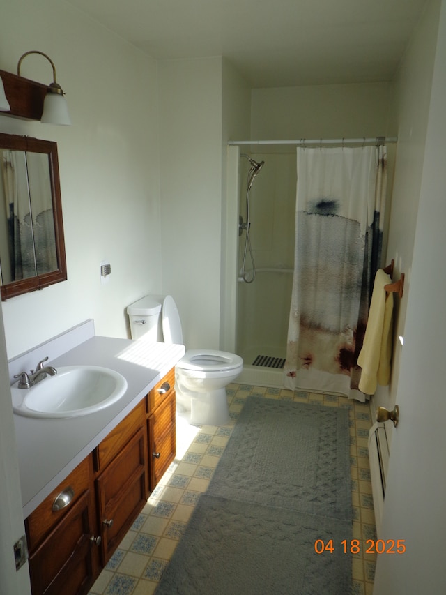 bathroom with vanity, tile patterned floors, a shower with curtain, and toilet