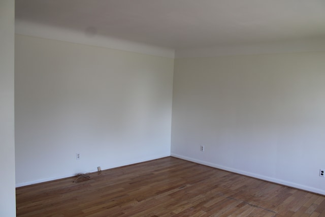 33185 Swallow Dr, Rockwood, MI 48173 - spare room with wood finished floors and baseboards