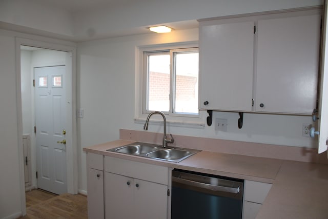 33185 Swallow Dr, Rockwood, MI 48173 - kitchen featuring white cabinetry, stainless steel dishwasher, a sink, light countertops, and light wood finished floors
