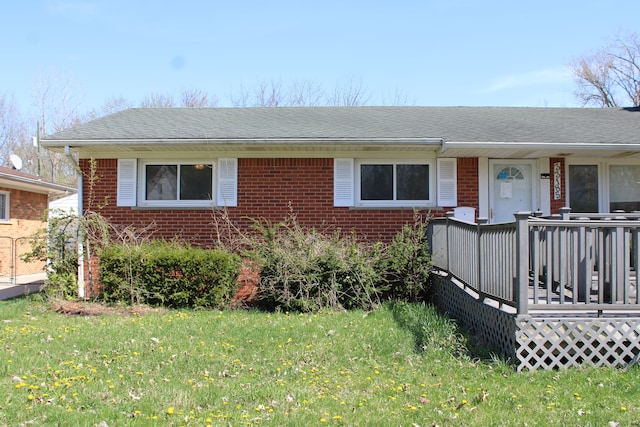 33185 Swallow Dr, Rockwood, MI 48173 - view of front of property featuring a front lawn, roof with shingles, and brick siding