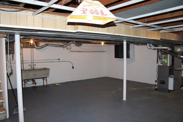 33185 Swallow Dr, Rockwood, MI 48173 - unfinished below grade area featuring heating unit and a sink