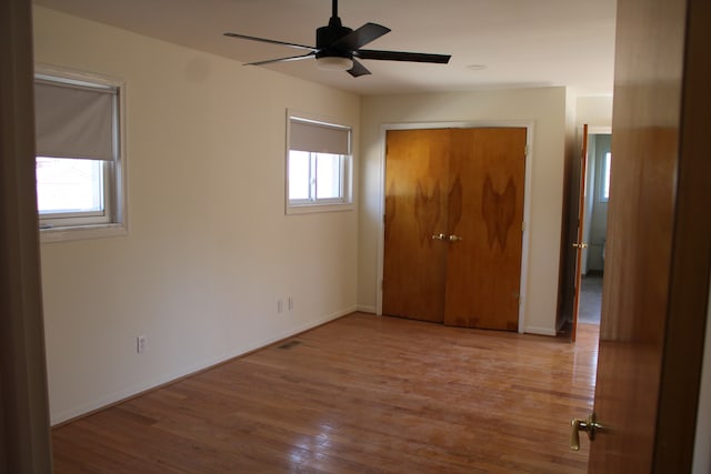 33185 Swallow Dr, Rockwood, MI 48173 - unfurnished bedroom with a closet, wood finished floors, and baseboards