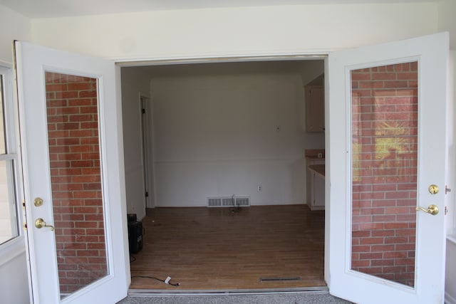33185 Swallow Dr, Rockwood, MI 48173 - property entrance featuring french doors and visible vents