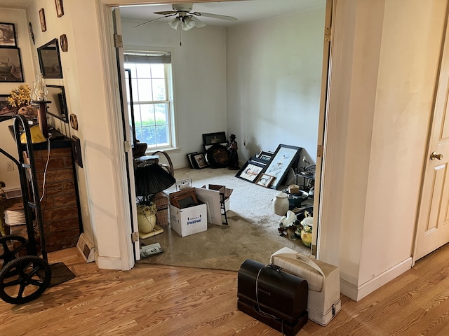 interior space featuring wood finished floors and ceiling fan