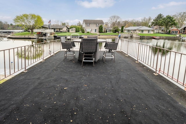 6950 Shore Dr, Coloma, MI 49038 - view of patio / terrace with fence, a residential view, and a water view