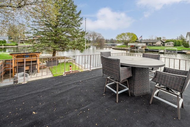 6950 Shore Dr, Coloma, MI 49038 - wooden deck with outdoor dining area and a water view