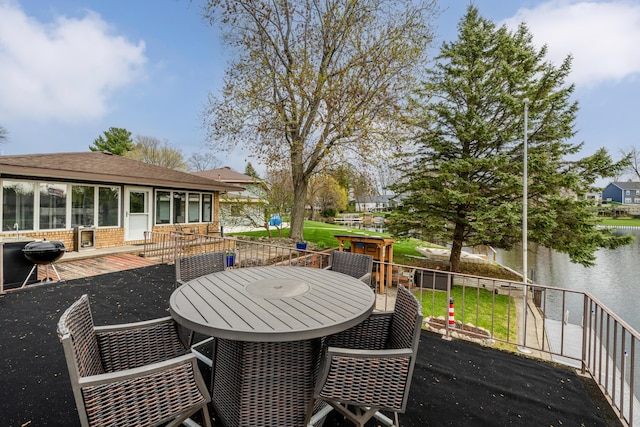 6950 Shore Dr, Coloma, MI 49038 - deck with grilling area, outdoor dining space, and a water view