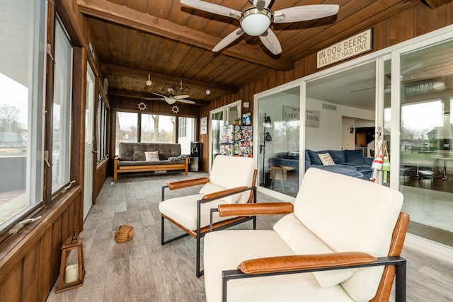 6950 Shore Dr, Coloma, MI 49038 - sunroom featuring wood finished floors, wooden walls, a ceiling fan, and wooden ceiling