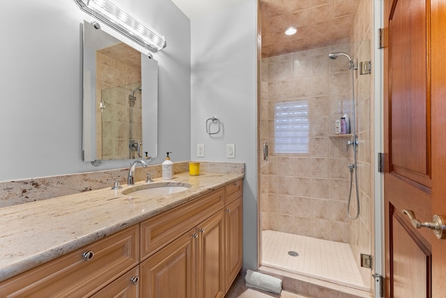 bathroom featuring vanity and a stall shower