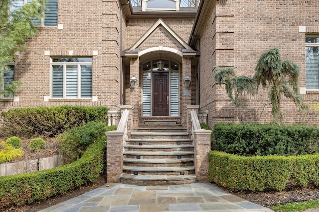 property entrance with brick siding