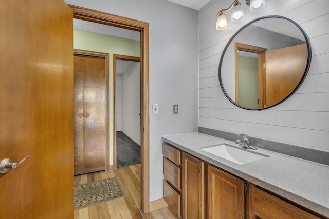 9015 Kingsley Dr, Onsted, MI 49265 - bathroom with vanity and wood finished floors