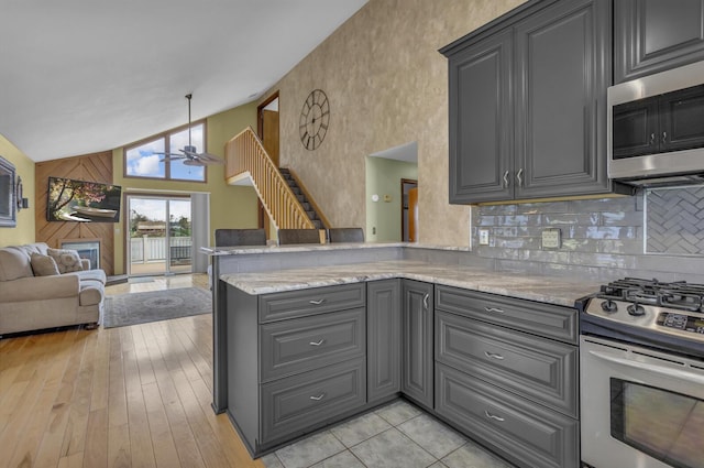 9015 Kingsley Dr, Onsted, MI 49265 - kitchen with appliances with stainless steel finishes, ceiling fan, gray cabinetry, open floor plan, and a peninsula