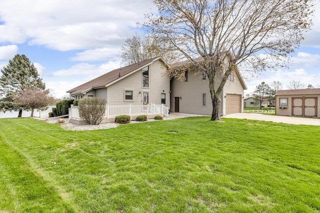 9015 Kingsley Dr, Onsted, MI 49265 - view of home's exterior with driveway, a yard, and an attached garage