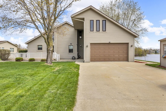 9015 Kingsley Dr, Onsted, MI 49265 - view of front of home featuring driveway, a front lawn, and a garage