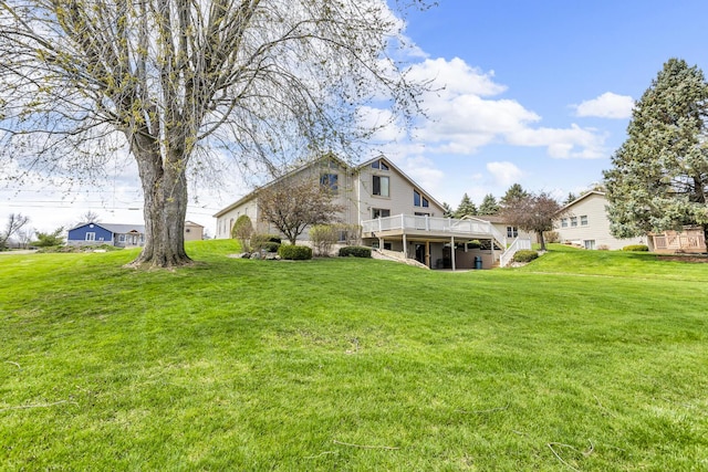9015 Kingsley Dr, Onsted, MI 49265 - back of property with a yard and a wooden deck