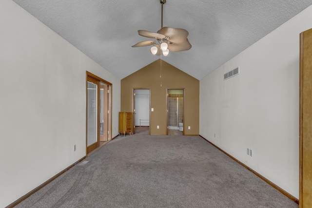 9015 Kingsley Dr, Onsted, MI 49265 - unfurnished room with a ceiling fan, visible vents, vaulted ceiling, baseboards, and a textured ceiling