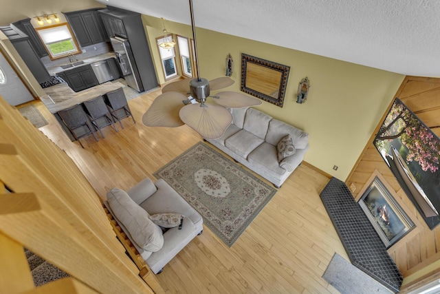 9015 Kingsley Dr, Onsted, MI 49265 - living room featuring light wood finished floors and a textured ceiling
