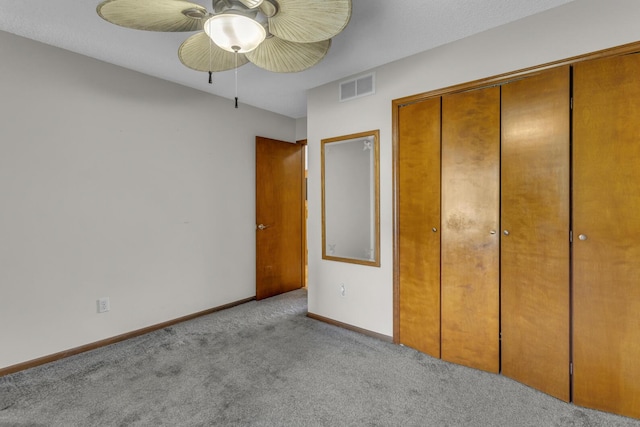 9015 Kingsley Dr, Onsted, MI 49265 - unfurnished bedroom featuring a closet, ceiling fan, carpet flooring, baseboards, and visible vents