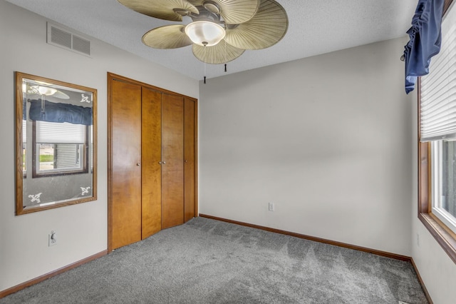 9015 Kingsley Dr, Onsted, MI 49265 - unfurnished bedroom featuring carpet floors, a closet, ceiling fan, baseboards, and visible vents