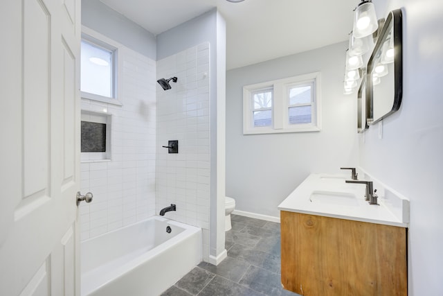 849 Chalmers St, Detroit, MI 48215 - bathroom featuring shower / tub combination, toilet, plenty of natural light, and a sink