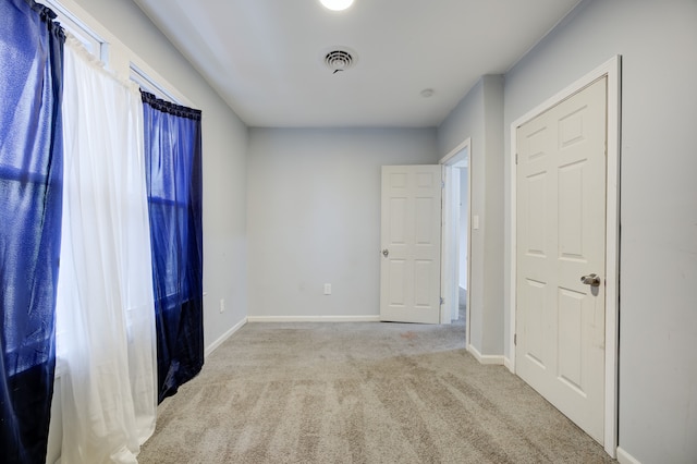 849 Chalmers St, Detroit, MI 48215 - carpeted empty room with visible vents and baseboards