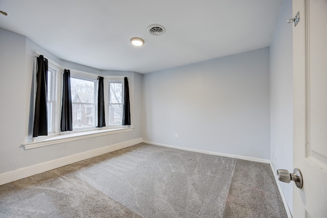 849 Chalmers St, Detroit, MI 48215 - unfurnished room with visible vents, carpet flooring, and baseboards