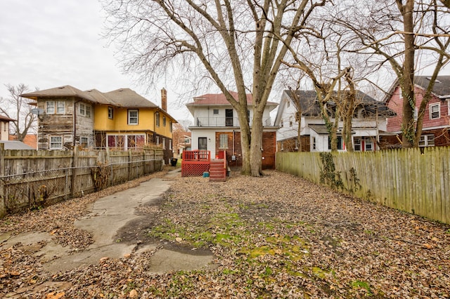 849 Chalmers St, Detroit, MI 48215 - view of yard featuring a residential view, a wooden deck, and a fenced backyard